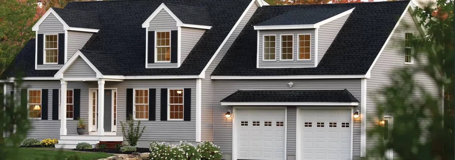 Gray lap siding on a New England Cape-style home
